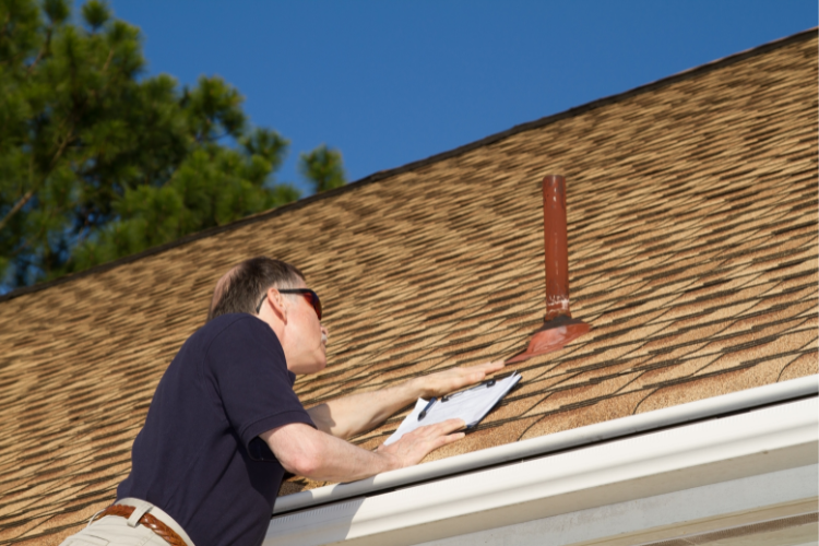 Athens roofer inspecting roof for hail season prep with Cantrell Roofing