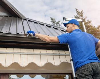 Cleaning roof gutters in Sherman